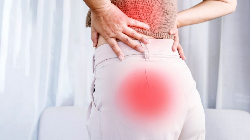 A Woman Suffering From Sciatica Pain