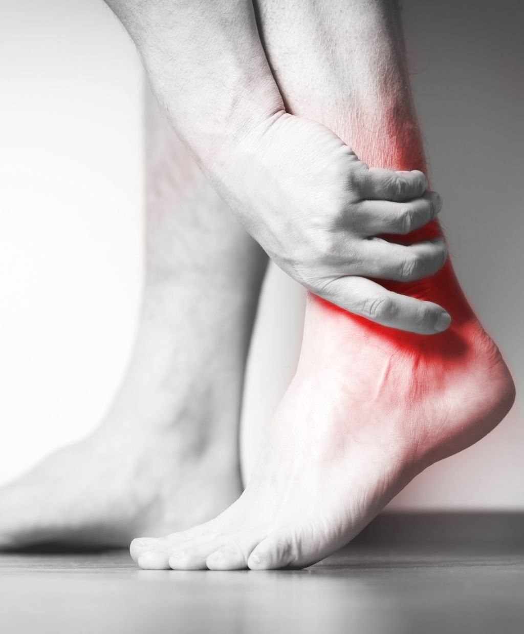 Person Experiencing Ankle Pain