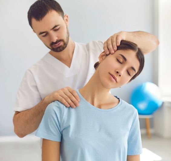 Therapist Stretching Patient’s Neck